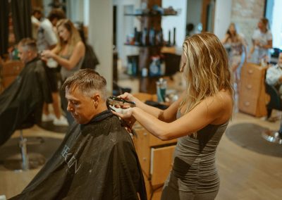 Hairstylist cutting hair